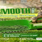SS Gold cordless battery-operated grass cutter trimming lawn grass in a garden, featuring a 12 AMP battery and 6–8 hours of working time for efficient garden maintenance.
